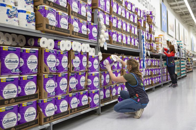 a person standing in front of a store