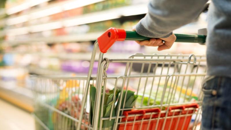 Man pushing grocery cart