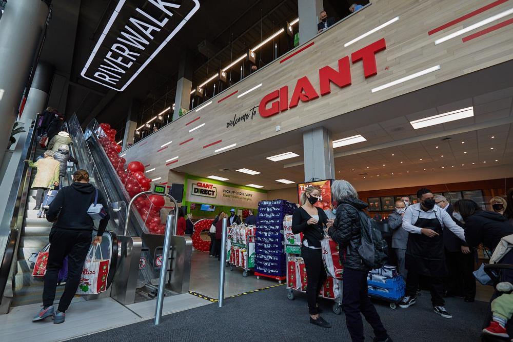 a group of people standing in front of a store