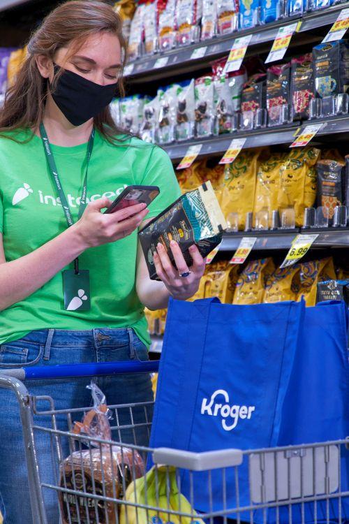 a person standing in front of a store