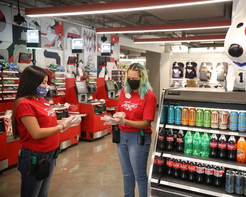 a group of people standing in front of a store