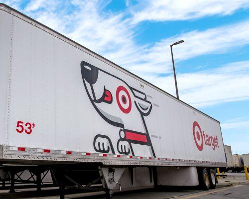 a truck with graffiti on the side of a road